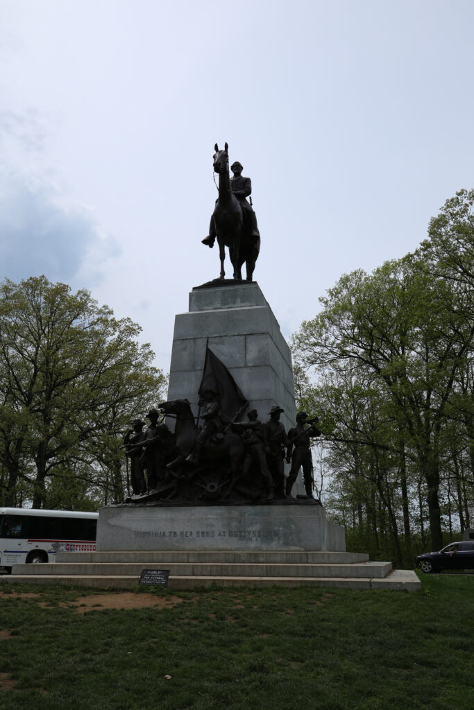Bronze statue of Robert E. Lee on his horse Traveller atop a tall granite pedestal, with a group of bronze soldiers at its base, Virginia State Memorial